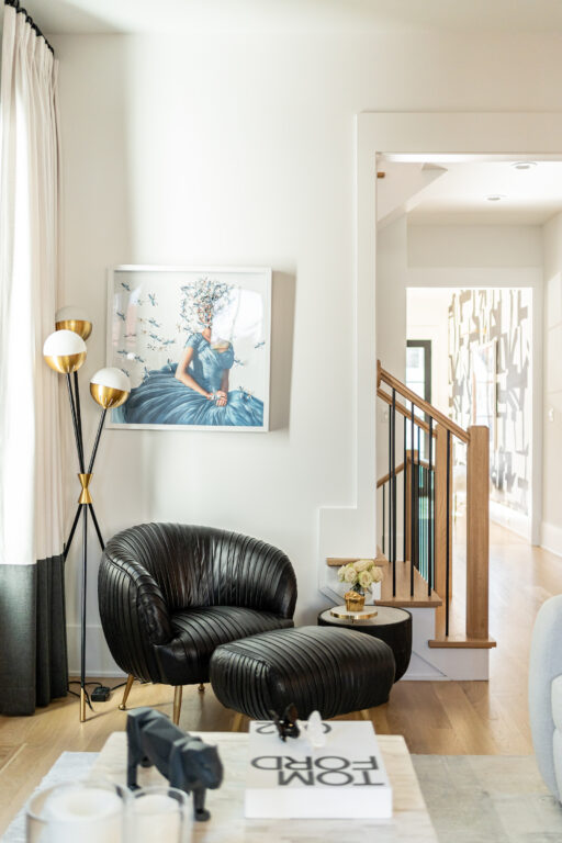 Chestnut black leather chair in corner with art piece custom furniture design