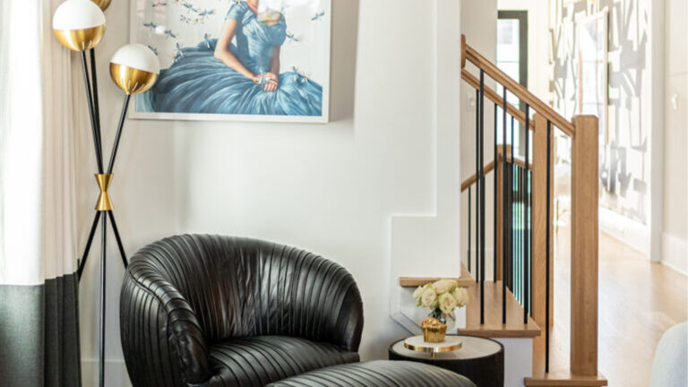 Chestnut black leather chair in corner with art piece custom furniture design and sphere floor lamp